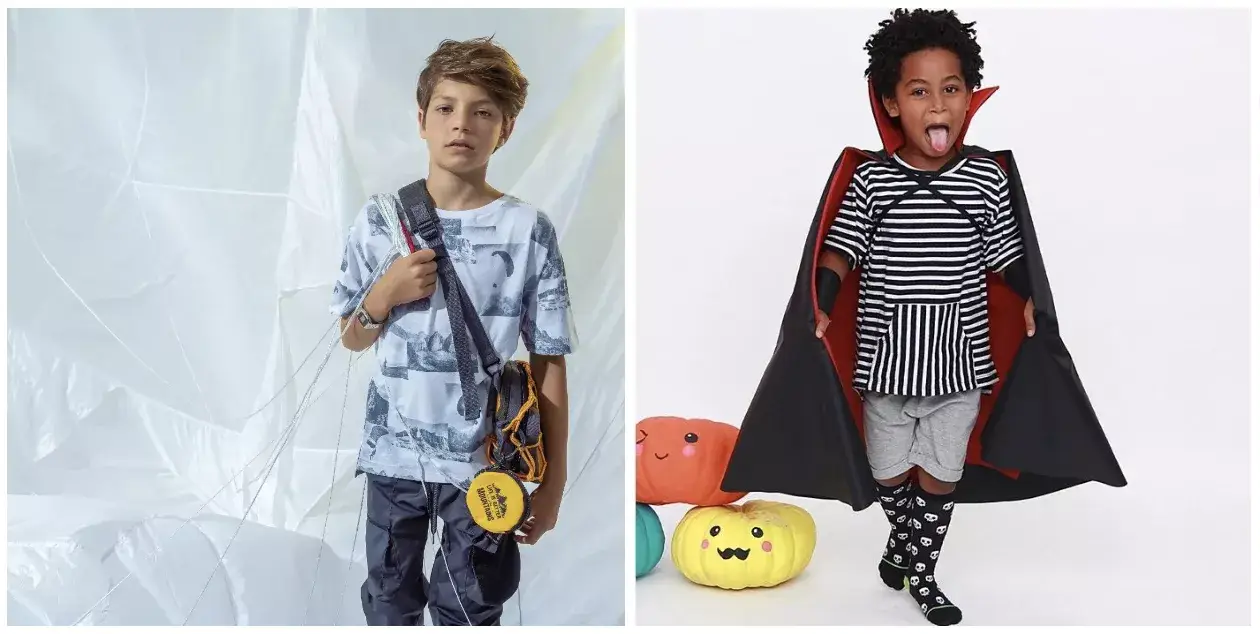 Menino loiro de camiseta e calça baggy e menino menor de fantasia de vampiro